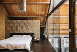 A peek at the lofted sleeping area. The home's three additional bedrooms are located on the main floor.  Photo 8 of 9 in A Light-Filled Loft in a Former Bakery Lists for $3.6 Million in London
