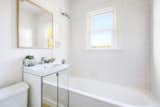 The bathroom has been fully remodeled and comes with a large soaking tub.