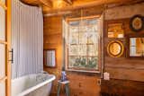 The converted barn offers two full baths—one with a clawfoot tub; the other with a rain shower.