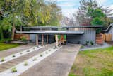 To omit corridor space, Carter designed the 1960s home with an expansive covered terrace protruding from the front facade. He used a similar design with many of his office buildings.  Photo 1 of 13 in A Restored Midcentury Wrapped Around a Reflecting Pool Lists for $1.39M in Sacramento, CA