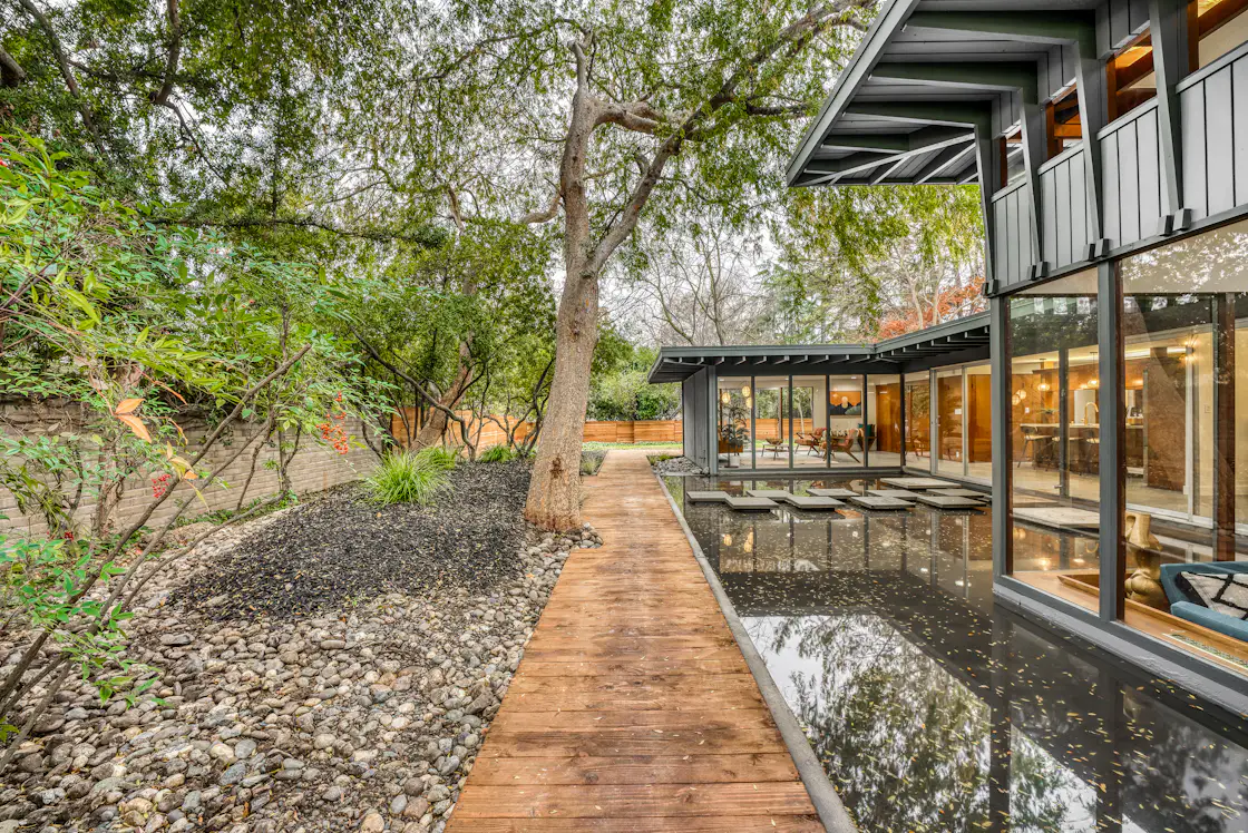 Photo 11 of 13 in A Restored Midcentury Wrapped Around a Reflecting