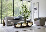 A sculptural Haywood coffee table (pictured here alongside the classic modern Hunter sofa and Cooper swivel chair) offers a timeless elegance designed to outlast trends.  Photo 4 of 7 in Embrace Sustainability and Style With Mitchell Gold + Bob Williams’ 2022 Spring Collection
