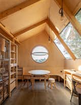 Visual artist Amélia Marta enlisted Portuguese architecture firm Madeiguincho to design a space where she could stargaze, make art, or just sit and think. To create the multipurpose but still economical interior, the designers got inventive with windows and wood.