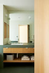 Another look at the primary bathroom. The faucet and fixtures are by Phylrich phylrich.com, while the Primavera Verde Tile is from Mutina.