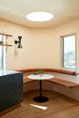 <span style="font-family: Theinhardt, -apple-system, BlinkMacSystemFont, &quot;Segoe UI&quot;, Roboto, Oxygen-Sans, Ubuntu, Cantarell, &quot;Helvetica Neue&quot;, sans-serif;">The breakfast nook off of the kitchen features rounded, built-in seating. T</span><span style="font-family: Theinhardt, -apple-system, BlinkMacSystemFont, &quot;Segoe UI&quot;, Roboto, Oxygen-Sans, Ubuntu, Cantarell, &quot;Helvetica Neue&quot;, sans-serif;">he home's windows are from Fleetwood Windows &amp; Doors.</span><span style="font-family: Theinhardt, -apple-system, BlinkMacSystemFont, &quot;Segoe UI&quot;, Roboto, Oxygen-Sans, Ubuntu, Cantarell, &quot;Helvetica Neue&quot;, sans-serif;"> </span>