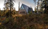 Architect Måns Tham designed an A-frame cabin in Edsåsdalen, Sweden, with ample space for Anders Smedberg and his family to host large groups for year-round outdoor adventures.