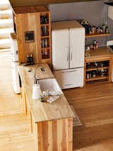 The kitchen features a Northstar retro refrigerator and a smaller fridge from Big Chill.