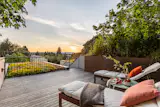 Starting with the average lot size of a single-family home in Seattle, Wittman created three residences by building up. From the rooftop deck, that tactic has a clear advantage.