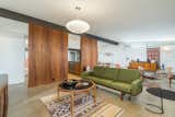 Concrete floors flow from the primary living spaces throughout the residence.  Photo 4 of 18 in A Signature Midcentury Modern by Architect Ralph Haver Seeks $1.1M in Phoenix