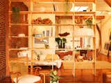 Installing the shelving unit proved to be an unexpected challenge. Because the building is so old, the floors aren't perfectly even, so the vertical 12' slabs didn't all fit. "We ended up having to cut some of them down,