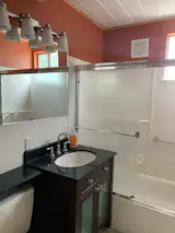 The existing bathroom was dated, and Polito wanted to thoughtfully update it with midcentury details.