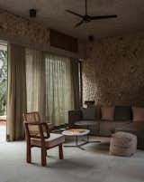 <span style="font-family: Theinhardt, -apple-system, BlinkMacSystemFont, &quot;Segoe UI&quot;, Roboto, Oxygen-Sans, Ubuntu, Cantarell, &quot;Helvetica Neue&quot;, sans-serif;">Marc and John filled much of the home with artwork and furniture by local creators. In the living room, Colima chairs and a Chihuahua coffee table, both by Mérida design studio Comité de Proyectos, accompany a Kubiko sofa from Marbol.</span><span style="font-family: Theinhardt, -apple-system, BlinkMacSystemFont, &quot;Segoe UI&quot;, Roboto, Oxygen-Sans, Ubuntu, Cantarell, &quot;Helvetica Neue&quot;, sans-serif;"> The d</span><span style="font-family: Theinhardt, -apple-system, BlinkMacSystemFont, &quot;Segoe UI&quot;, Roboto, Oxygen-Sans, Ubuntu, Cantarell, &quot;Helvetica Neue&quot;, sans-serif;">rapes are from Telas Bayon.</span>