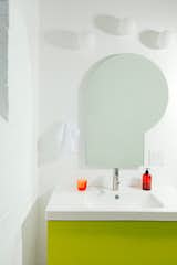 The bathroom vanity features a neon hue known as "optic yellow,  Photo 5 of 6 in What’s the Right Fragrance for My Bathroom?