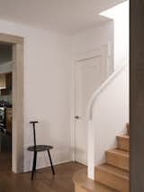 A Faye Toogood Spade chair sits in the downstairs hall.