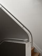 ODAMI designed a new railing that picks up a language of curves found throughout the house.