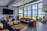 In the living room, a multipaned glazed wall captures ocean views.