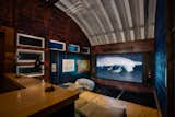 A barn/workshop offers a home theater with a 110-inch projection screen.  Photo 17 of 20 in Live on This Off-Grid “Art Farm” With Views of Maui’s Haleakalā Volcano for $4M