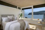 The principal bedroom opens to a private deck overlooking the bay.