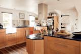 “The large kitchen is to the left of the stairs, with granite work surfaces centered around a large island unit,” says the listing agent.  Photo 5 of 12 in An 1850s Mill With a Detached Rental Unit Lists for £1.5M in South West England