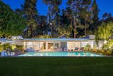 The boxcar-style home features a broad roof, spider leg columns, and retractable glass doors.  Photo 11 of 11 in Richard Neutra’s Boxcar-Style Loring House Lists for $8M in the Hollywood Hills