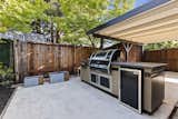 The Claude Oakland–designed Eichler also includes a side yard with an outdoor kitchen.
