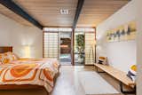 The principal bedroom has Japanese-style shoji screens that slide to reveal the home’s hidden highlight: an indoor spa with a hot tub.  Photo 10 of 18 in A Respectfully Renovated “Super Eichler” Asks $2.5M in Walnut Creek, CA