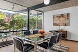 The home’s original post-and-beam construction is on clear display in the dining room.  Photo 7 of 18 in A Respectfully Renovated “Super Eichler” Asks $2.5M in Walnut Creek, CA