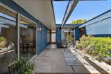 The home retains its open-air atrium, a signature element of Eichler homes.  Photo 2 of 12 in $1.9M Will Land You This Tastefully Updated “Pop-Top” Model Eichler in the Bay Area