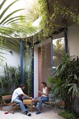 The resulting home is overflowing with greenery—and it's the perfect place for its owner, Patricio Martinez, and his girlfriend, Nati Malamute, to unwind.  Photo 2 of 12 in This House in Buenos Aires Now Encloses a Small Jungle After Some Clever Carving