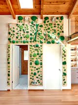 A sensitivity to color and texture drove many design decisions. In the family room, a plywood climbing wall adds a playful touch.