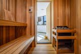 Another spa-like aspect of the home is the sauna that connects to the workout room.  Photo 15 of 16 in An Earthshipesque Home by a Frank Lloyd Wright Protégé Hits the Market for the First Time