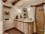 "The sink and cabinets are finished in beautifully patterned cork," says the listing agent.