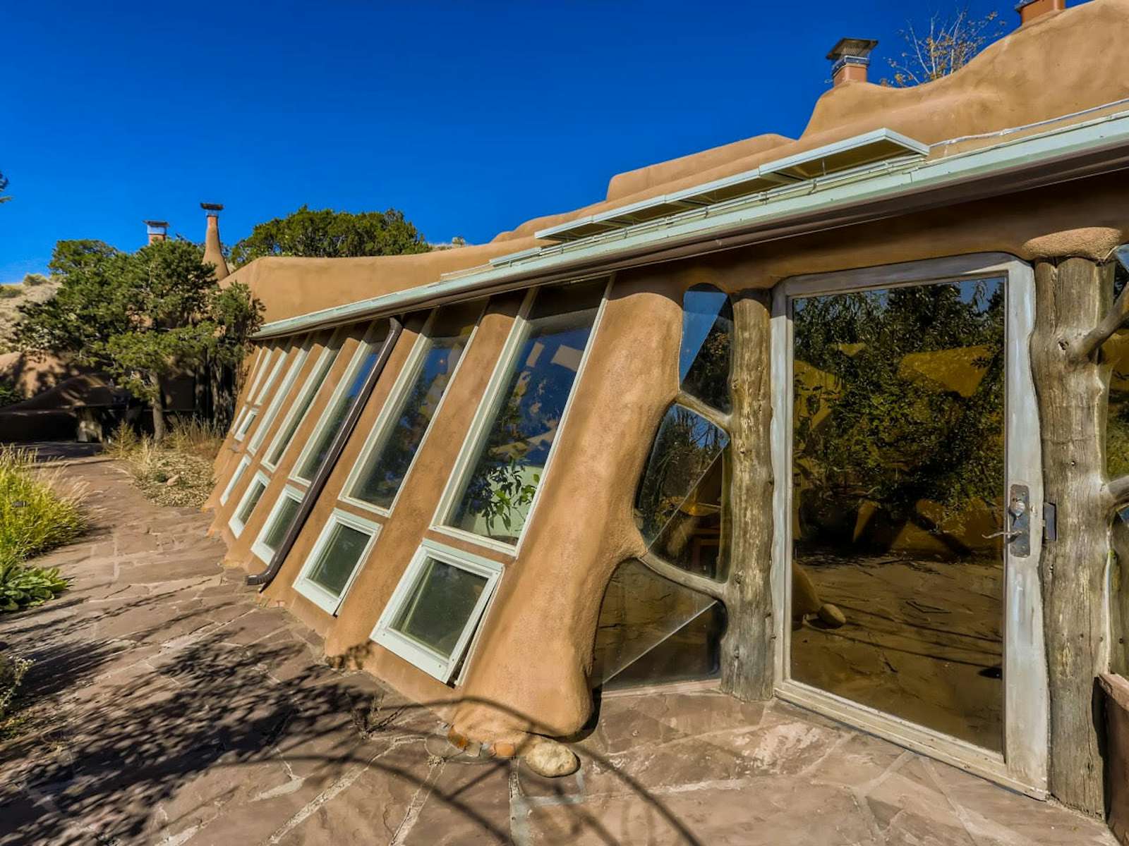 Photo 3 of 18 in An EarthshipInspired Desert Home Asks 3.5M in Santa