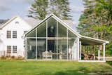 Designer Tom Givone transformed a 19th-century homestead in Eldred, New York, into his peaceful weekend retreat, dubbed the Floating Farmhouse. During the renovation, Givone added a new wing to the original gabled structure that is finished with a 22-foot-tall wall of glass.