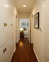 The hallway leading into the second bedroom has additional storage cabinets.&nbsp;