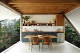 The vintage chairs are by Hans Wegner, while the table, cabinets, and the rest of the furnishings in the home were designed and built by Doug.