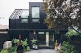 The laneway house is just across a small shared patio behind Robert and Debra’s house.  Photo 11 of 51 in out by C from A Toronto Alley Is Reanimated With An Apartment and Studio Pop-up