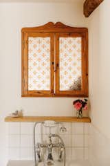 Vintage patterns and details keep the bathroom fresh, while honoring its long history.&nbsp;