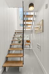 Cantilever stairs with three windows and an<span style="font-family: Theinhardt, -apple-system, BlinkMacSystemFont, &quot;Segoe UI&quot;, Roboto, Oxygen-Sans, Ubuntu, Cantarell, &quot;Helvetica Neue&quot;, sans-serif;"> </span><span style="font-family: Theinhardt, -apple-system, BlinkMacSystemFont, &quot;Segoe UI&quot;, Roboto, Oxygen-Sans, Ubuntu, Cantarell, &quot;Helvetica Neue&quot;, sans-serif;">occupiable</span><span style="font-family: Theinhardt, -apple-system, BlinkMacSystemFont, &quot;Segoe UI&quot;, Roboto, Oxygen-Sans, Ubuntu, Cantarell, &quot;Helvetica Neue&quot;, sans-serif;"> spandrel create an inviting transition between floors. </span>