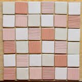 "These small Corduroy tiles were inspired by the backsplash of my studio slop sink, which I made with tinted clay tiles that had a slight tonal variation of pink hues. I chose satin finish glazes to mimic the matte finish of tinted clay," says Levi.&nbsp;