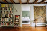 The second-floor landing looks onto a secondary bedroom and serves as a reading room.