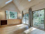 The living area features a small kitchenette and sliding doors for easy access to nature.&nbsp;