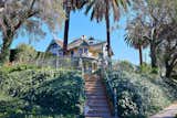 Sitting atop a small hill, the property features an original stairway, complete with gate and ornament.  Photo 2 of 23 in Asking $2M, a Striking Victorian-Style Home in San Diego Features All Its Original Trimmings