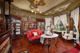 The original bookcases and shelves remain in the home, as well as the hardwood flooring.  Photo 9 of 23 in Asking $2M, a Striking Victorian-Style Home in San Diego Features All Its Original Trimmings