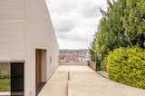 From the driveway, visitors get a glimpse of the view that the house, with its massive windows facing the city center, promises to provide upon entry.