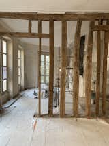 The architect removed the wall material that wrapped the existing wood framework, giving the spaces warmth and texture.