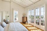 Take advantage of a spectacular view and position your bed to face a wall of French doors. 
