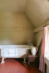 A freestanding, cast-iron soaking tub awaits upstairs near the main bedroom.