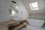 “The main bathroom vanities were made with reused tepa and ulmo wood,” Chrismar says.