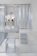 Curtains made out of bubble wrap provide privacy while allowing sufficient light to enter the interior.
